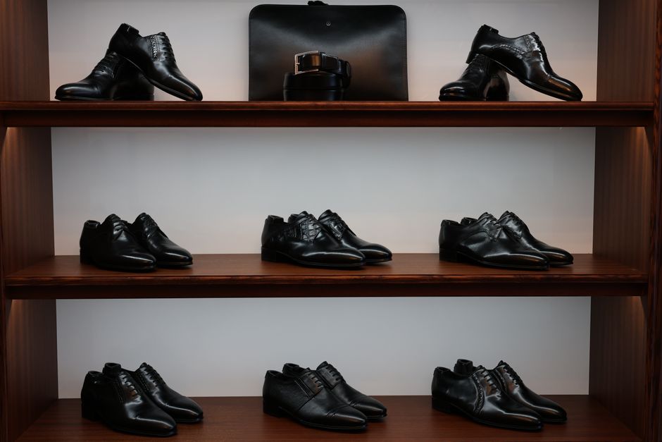 Custom wooden shoe display shelves in a closet
